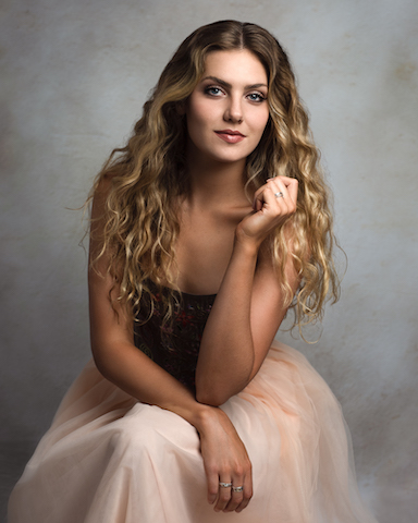 Female client at wp portraiture studios in her gown for formal portrait